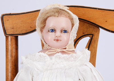 Lot 806 - An 19th century English poured wax doll dressed as a baby