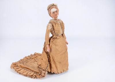 Lot 820 - A late 19th century German wax over composition lady doll in fine court dress