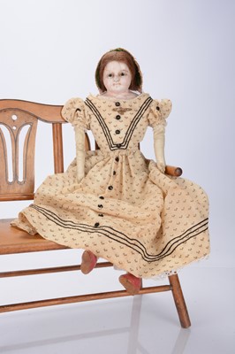 Lot 822 - An 1840s English wax over papier-mâché child doll