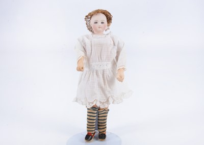 Lot 893 - An E Barrois fashion doll with swivel head