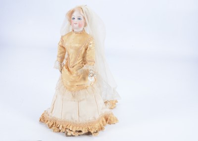 Lot 897 - A French fashion doll with swivel head in bridal dress