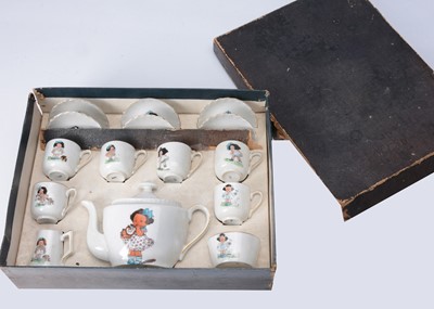 Lot 905 - A continental doll's tea set, with comic girl 1910-20s