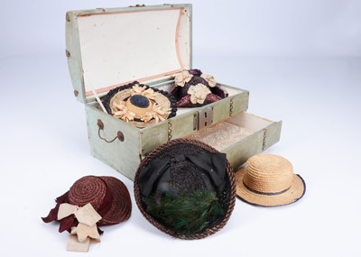 Lot 924 - A 19th century eau d'Nil oilcloth doll's trunk and hats
