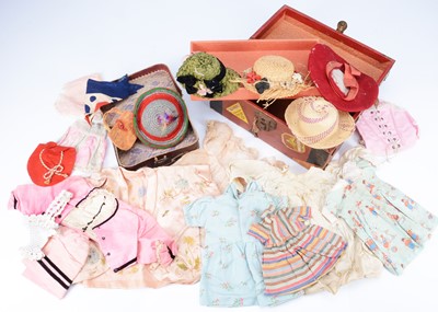 Lot 934 - A selection of small to mid size 20th century doll's clothes and trunk