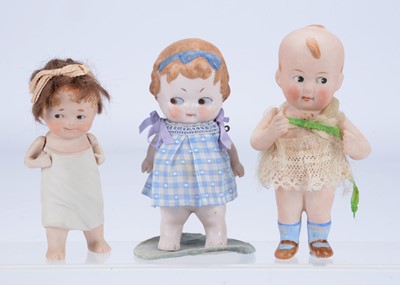 Lot 971 - Three all bisque googly-eyed character babies