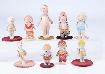 Lot 976 - Nine small all bisque googly eyed character figures