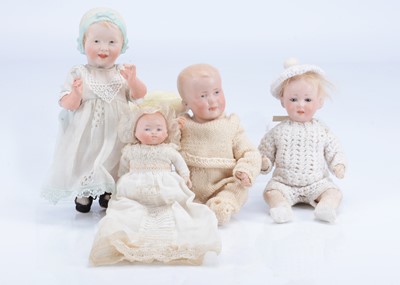 Lot 982 - Four small German character baby dolls