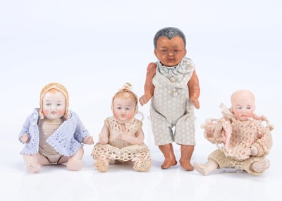 Lot 984 - Four small German character baby dolls