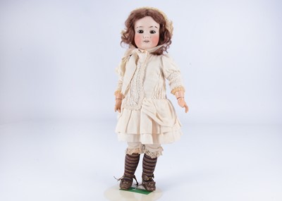 Lot 1014 - A French Limoges bisque headed child doll