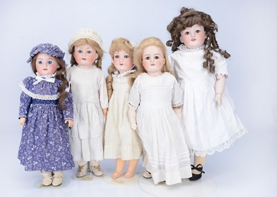 Lot 1017 - Five bisque headed dolls