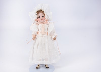 Lot 1030 - A small DEP bisque headed child doll