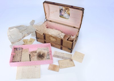 Lot 1047 - A mid 19th century doll's domed trunk with interesting contents