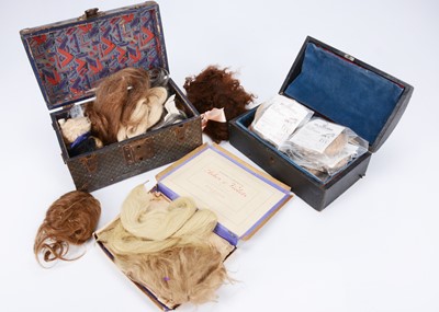 Lot 1078 - Two small dolls trunks containing wigs