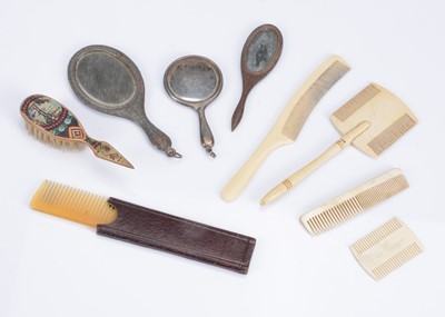 Lot 1087 - A selection of doll's combs and brushes