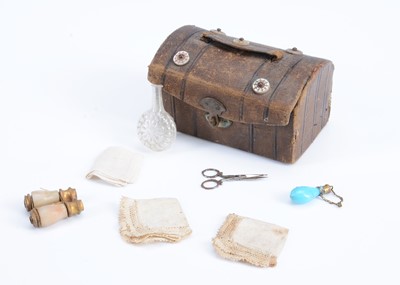 Lot 1092 - A miniature leather doll's trunk