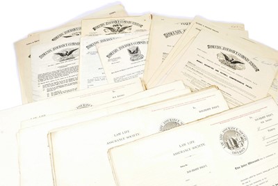 Lot 185 - A folio containing specimen and blank policies