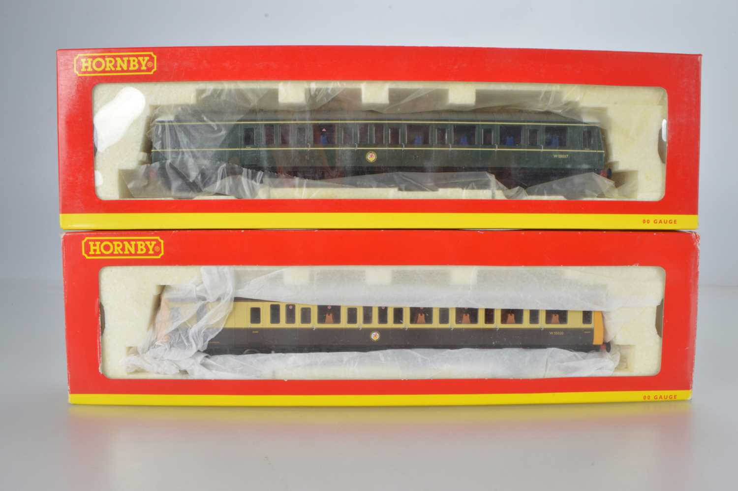 Lot 96 - Hornby (China) boxed 00 Gauge Class 121 BR green and Chocolate and cream Driving Motor Brake Diesel Railcars