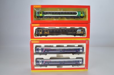 Lot 97 - Hornby (China) boxed 00 Gauge First Scotrail Class 156 and Wessex  and Northern Rail Class 153 Diesel Railcars            (3)