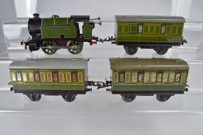 Lot 690 - Hornby 0 Gauge SR green 0-4-0 No E126 body on Clockwork chassis and three No 1 SR 4-Wheel Coaches (4)