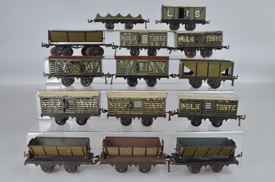 Lot 700 - Bing O Gauge goods long thin wagons consisting of 5 x Milk wagons, 1 x horse box, 1 x open wagon 4 x tipping wagons, 1 x barrel wagon and 1 x coal wagon, (14)