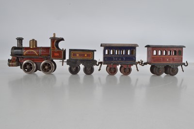 Lot 718 - A Bing O Gauge 0-4-0 Locomotive and Tender Midland railway No 116, together with 2 x continental coaches in blue and red, (4)