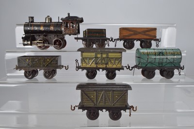 Lot 800 - Bing O Gauge 0-4-0 Locomotive, No 210 with Bing tender, 2 x covered vans, 1 x Shields and Brown tanker, 1 x coal wagon and 1 x Lumber wagon, (7)