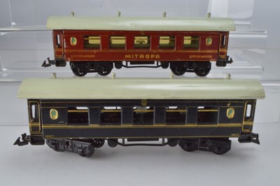 Lot 802 - Bing O Gauge late edition continental dining car in royal blue with gold lining, No 10571, together with a Bing Dining car in Red and gold lining 'Mitropa' No 10571, (2)