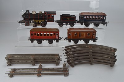 Lot 808 - Bing O Gauge 0-4-0 Locomotive and Tender, Black lined red, No 0-35, 2 x continental coaches, 1 x Parcel coach,  O Gauge 3 rail track 4 x straight track and 6 x curves, (14)