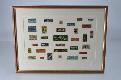 Lot 859 - A qty of framed Bassett Lowke and similar miniature advertising enamel signs to include 'Oxo', 'Frys Chocolate', 'Bournville Cocoa', 'Sketchley Dry Cleaners' in sealed frame, (32)