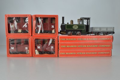 Lot 878 - Mamod O Gauge Live steam 0-4-0 SL1 steam Locomotive, 4 x boxed Passenger coaches, 1 x open wagon, 2 boxes of curved track and 1 x straight track, (9)