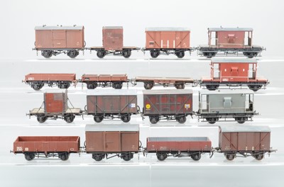 Lot 911 - A qty of kit / commercially built O gauge rolling stock to include, 5 x flat wagons, 1 x Fruit Van, 2 x Shocvans, 1 x Banana van, 2 x covered vans, 3 x Brake Vans, 2 x 5 plank wagons, (16)