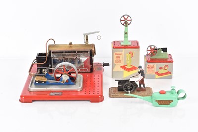 Lot 1012 - Mamod Live steam SP5 twin cylinder stationary engine, with boxed mamod Power press, Power Hammer, mamod oil can and Fleischmann Blacksmith accassoiery (5)