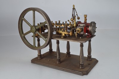 Lot 1043 - A horizontal 19th/20th century live steam stationary engine mounted on 6 turned metal legs with crankshaft driven boiler feedpump, govenor and approx 7 1/2 inch dia flywheel (19cm) 