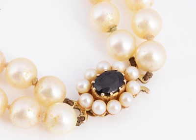 Lot 5 - A double row cultured pearl necklace with 9ct gold pearl & garnet set clasp