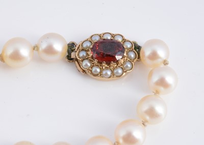Lot 14 - A uniform knotted cultured pearl necklace, with 9ct gold clasp