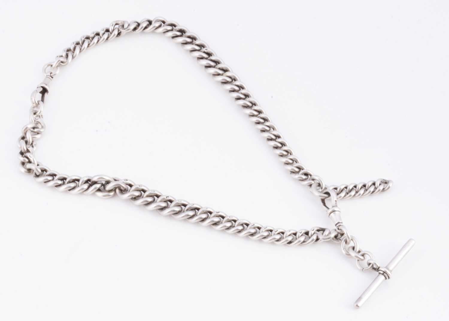 Lot 16 - An Edwardian silver double albert curb chain