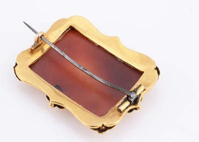 Lot 22 - An antique carnelian gilt framed brooch