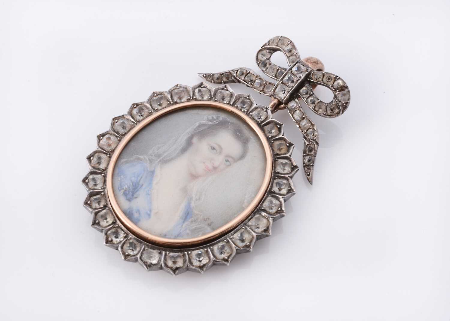 Lot 34 - An antique miniature portrait pendant on ivory by Samuel Shelley (English, 1750-1808)