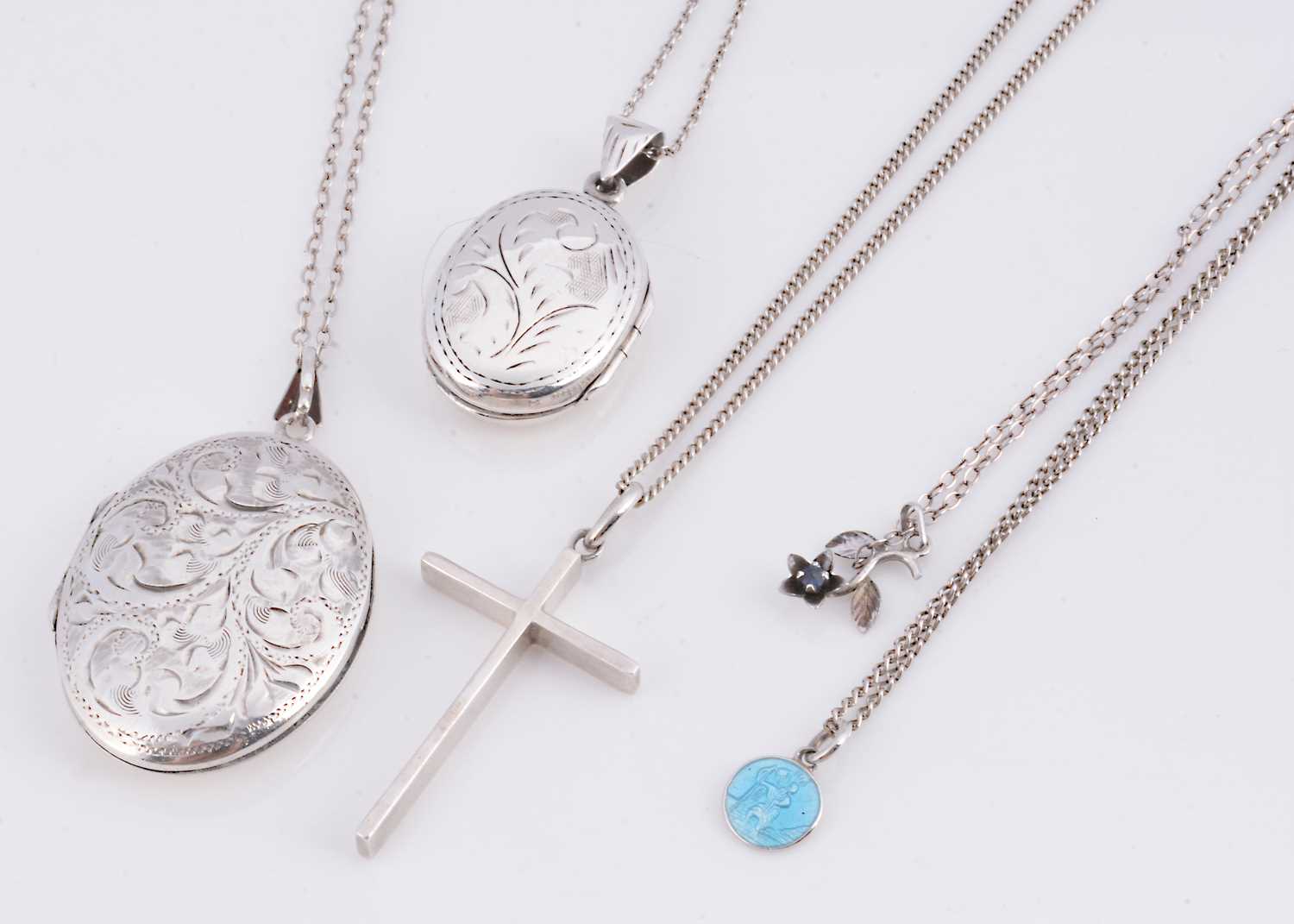 Lot 73 - Two silver engraved oval lockets