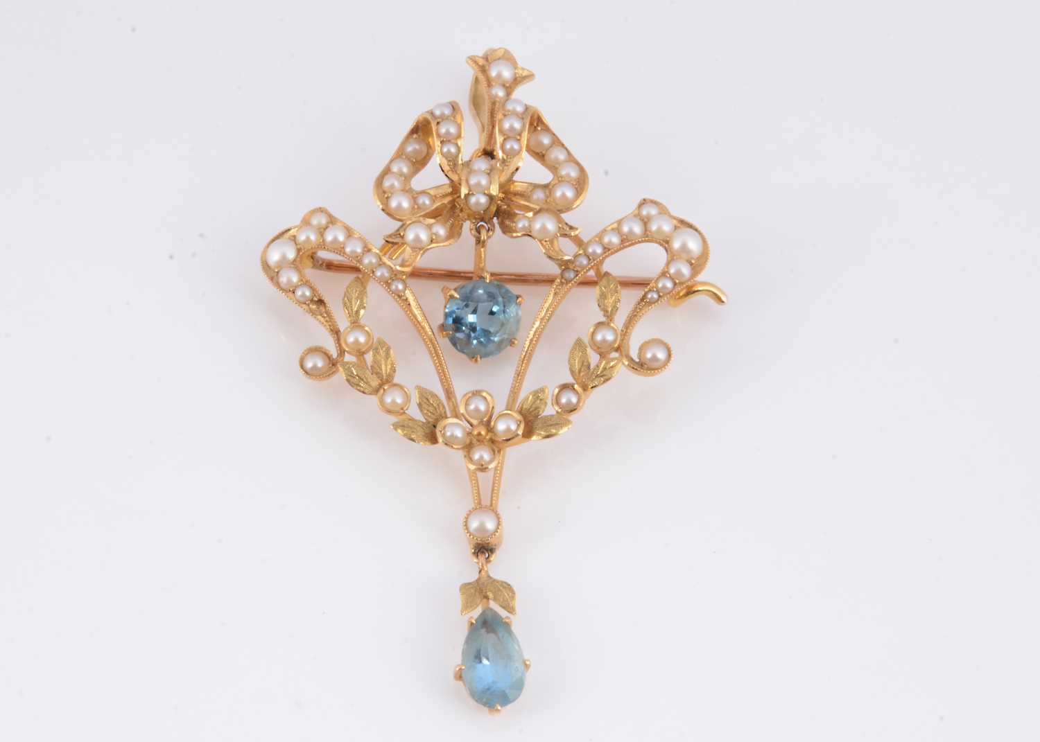 Lot 92 - An Edwardian seed pearl & aquamarine brooch pendant