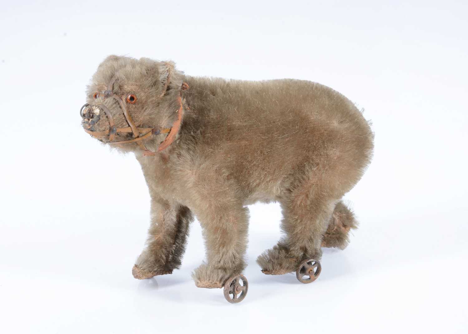 Lot 20 - An early German muzzled walking bear on wheels