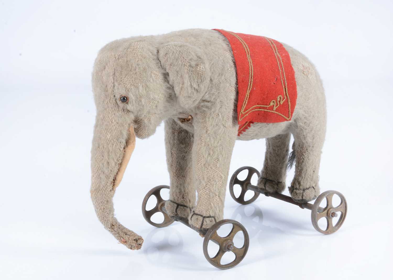 Lot 21 - An early Steiff burlap elephant on wheels, circa 1908