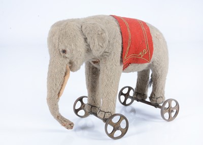 Lot 21 - An early Steiff burlap elephant on wheels, circa 1908