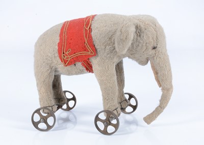 Lot 21 - An early Steiff burlap elephant on wheels, circa 1908
