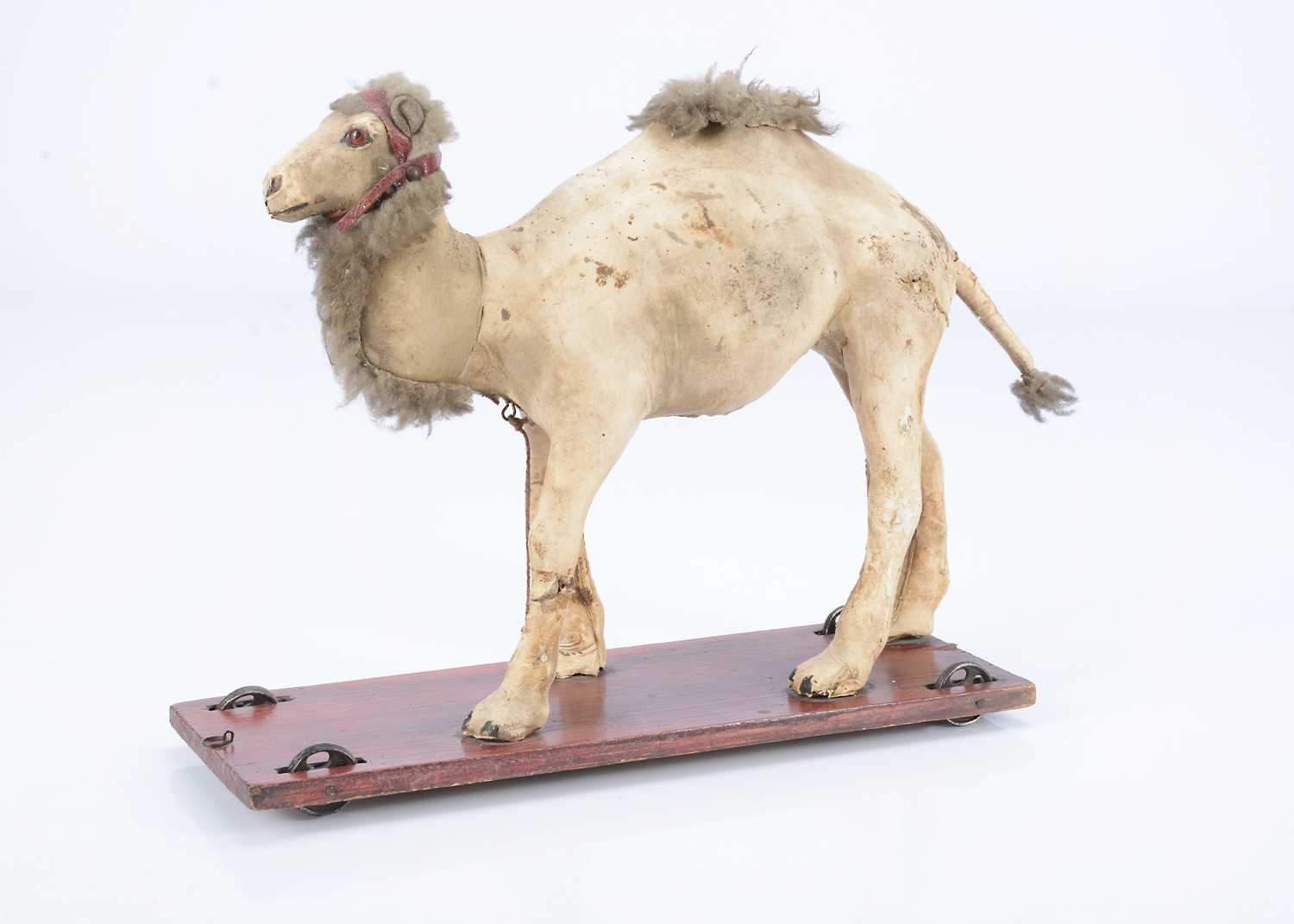 Lot 27 - An 19th century skin covered nodding camel on wheels