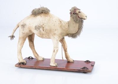 Lot 27 - An 19th century skin covered nodding camel on wheels