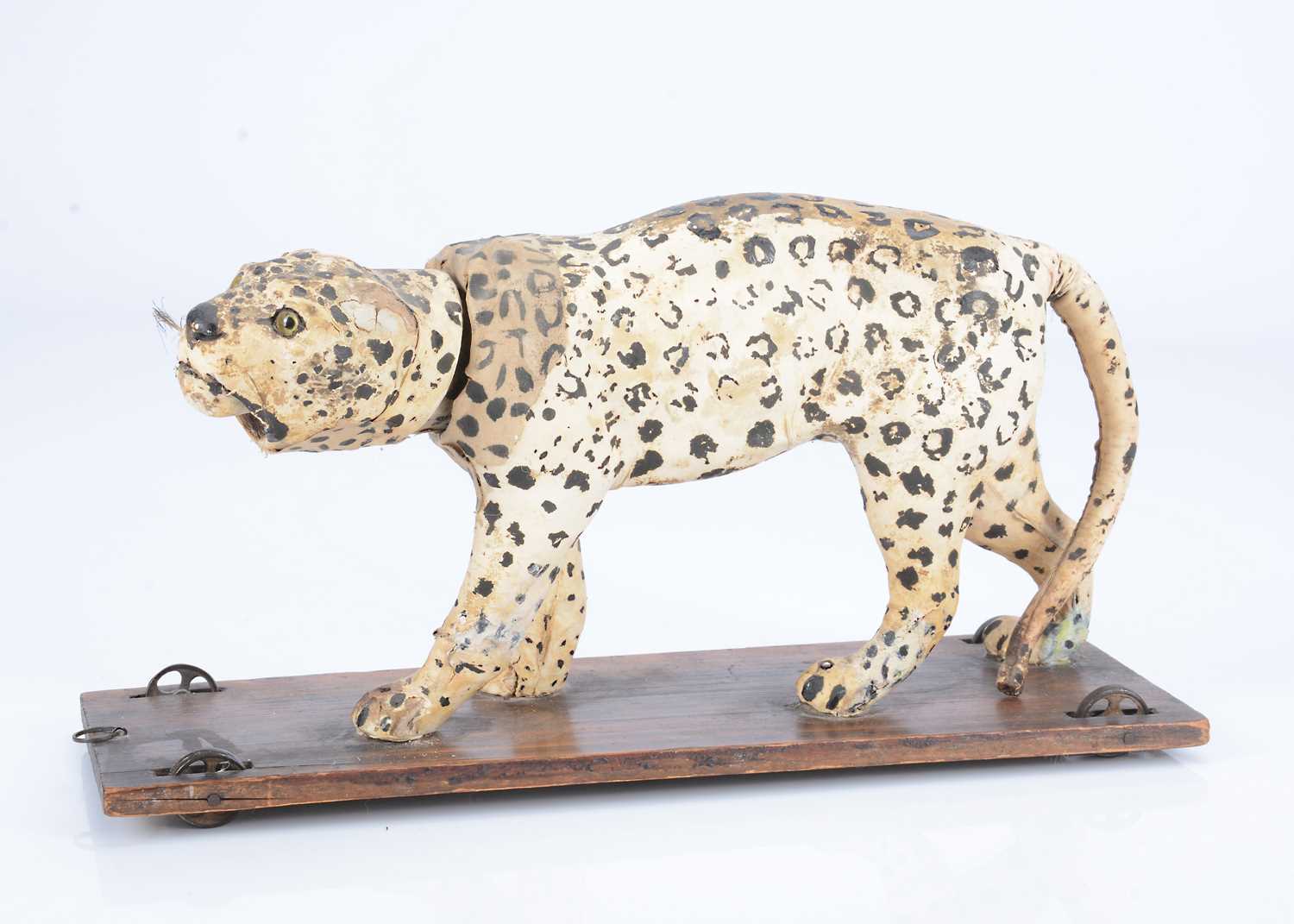 Lot 28 - An 19th century skin covered nodding leopard on wheels