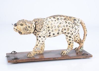 Lot 28 - An 19th century skin covered nodding leopard on wheels