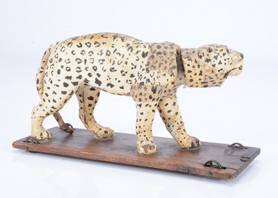 Lot 28 - An 19th century skin covered nodding leopard on wheels