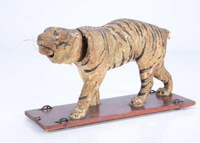 Lot 29 - An 19th century skin covered nodding tiger on wheels